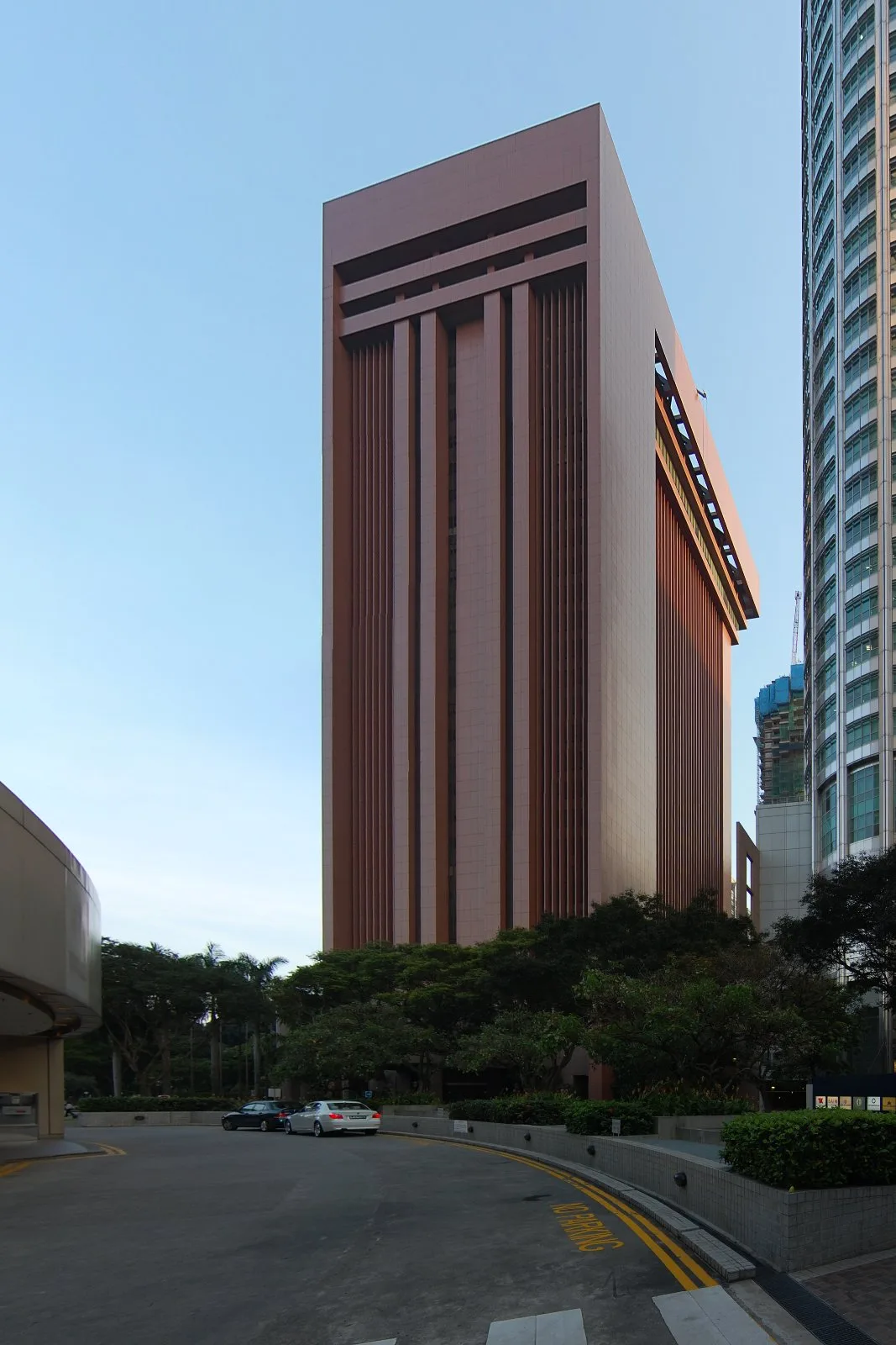 Exterior view of the Singapore Exchange Centre building in the central business district, its glass facade reflecting the surrounding skyline