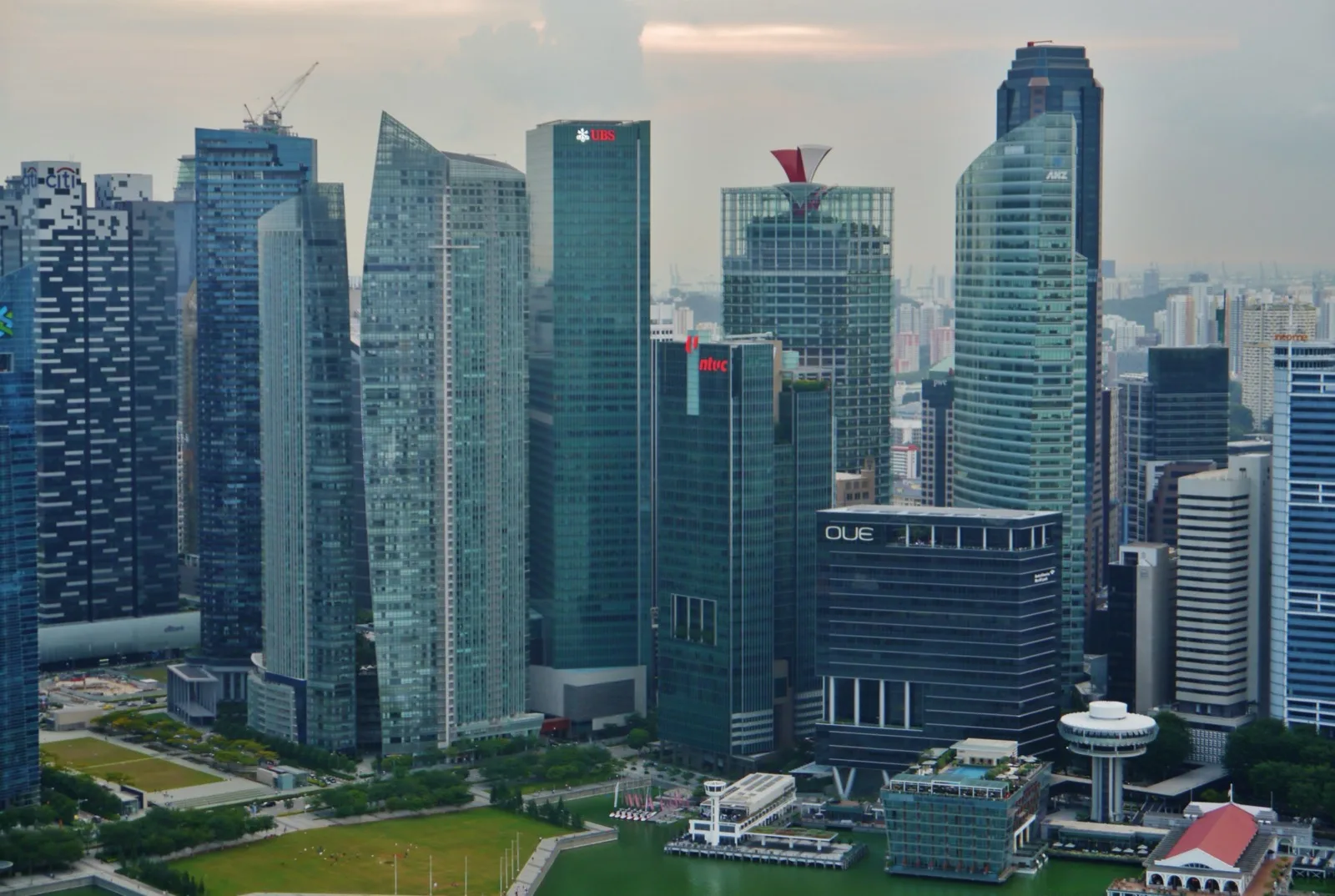 Modern office towers and mixed-use real estate skyline in Singapore's central business district under daytime sky