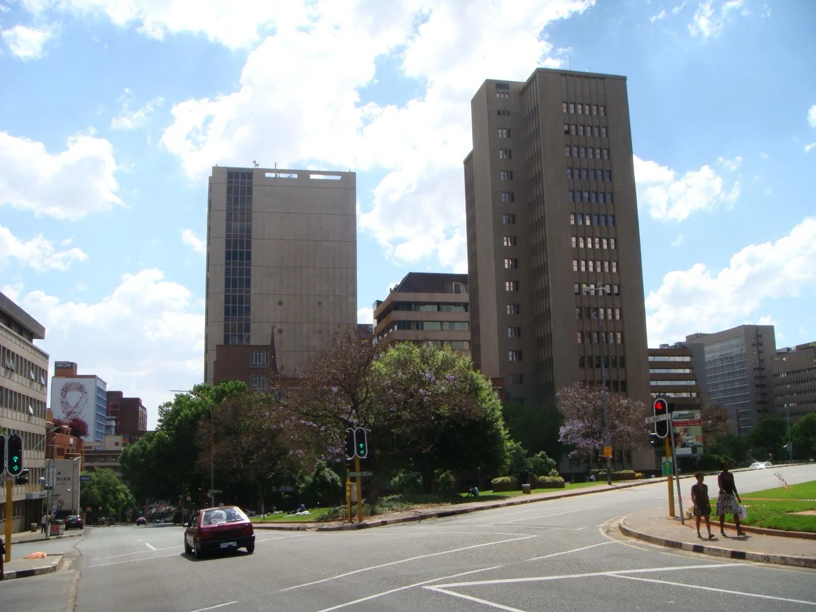 Exterior view of the Johannesburg Stock Exchange building with its glass facade and signage