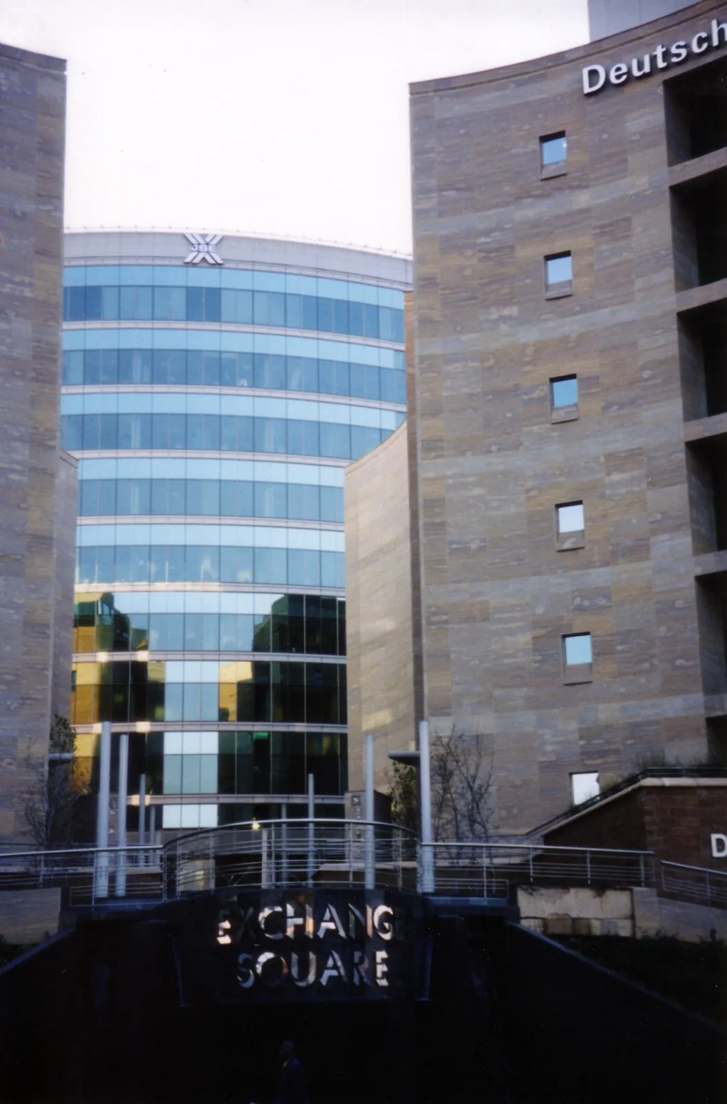 Exterior view of the Johannesburg Stock Exchange building with its glass facade and signage
