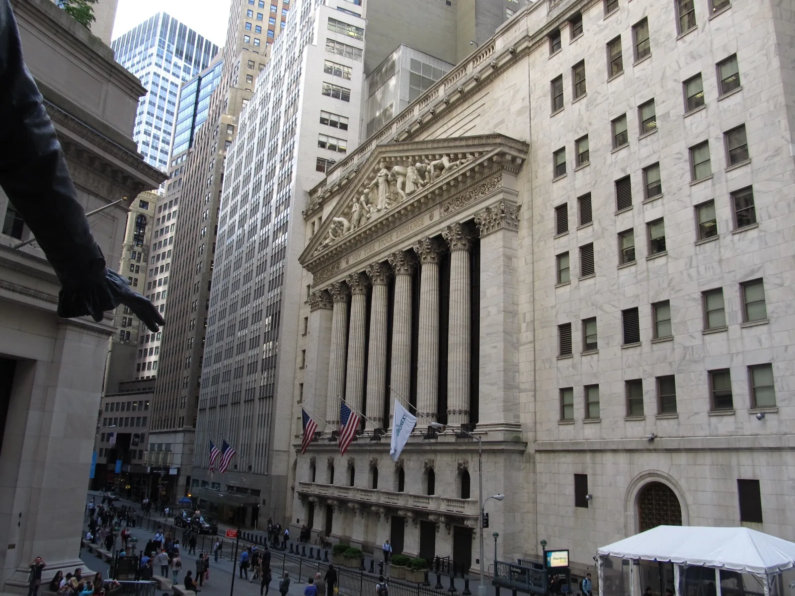 A stock exchange trading floor display showing ticker symbols and price movements, representing companies going public