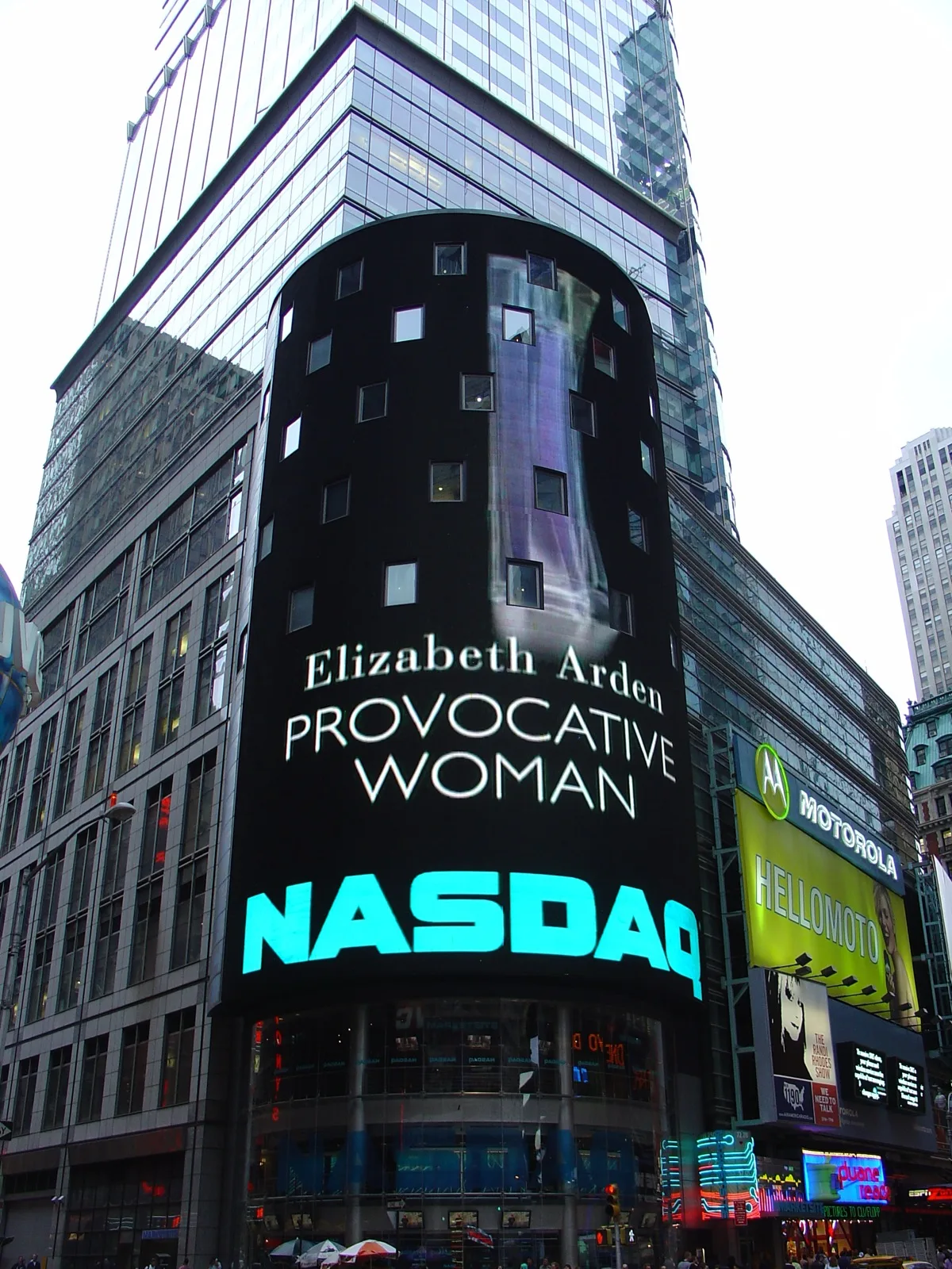 A financial newsroom digital display showing scrolling corporate earnings figures and stock tickers during a busy reporting period